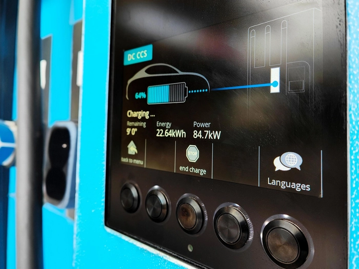 Ev_electric_vehicle_charging_station_hub_with_visual_icon_screen_display_ui.webp